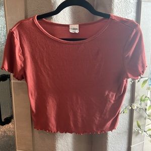 Burnt orange crop top with scalloped edging details
